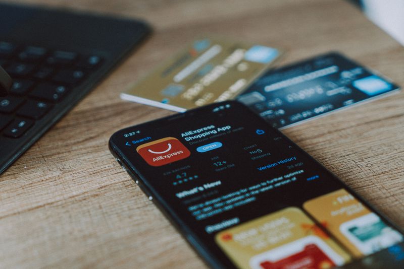 A phone on a table. It's open to a financial app.