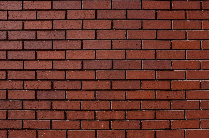 A brick wall symbolizing a wall of text.