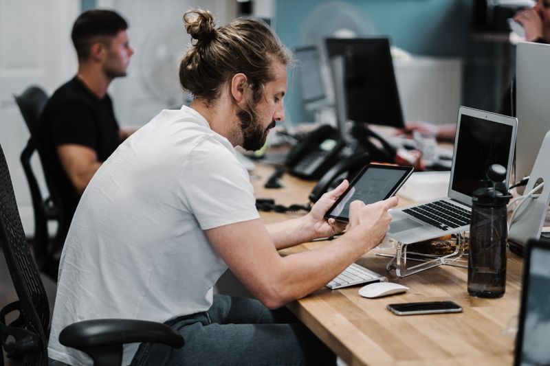 Man searches for information on his tablet.