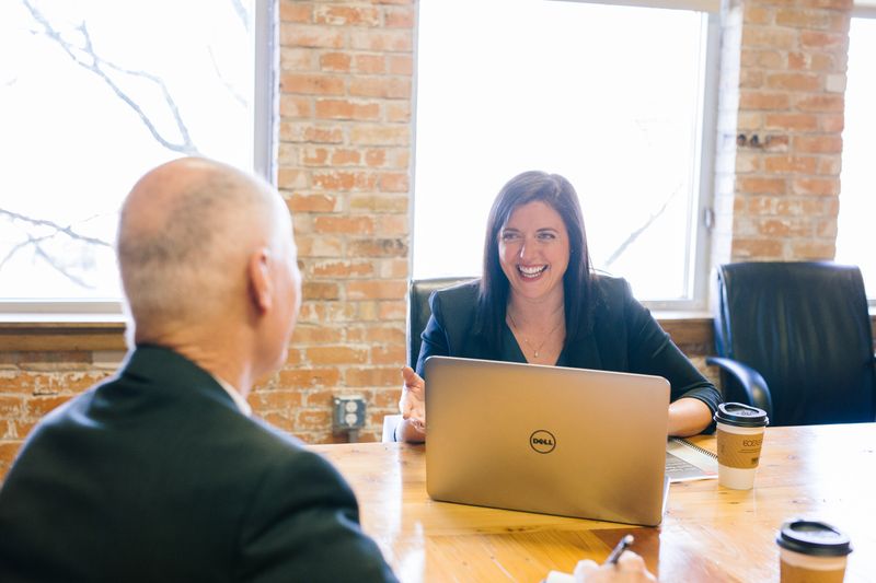 Two people talking in an office