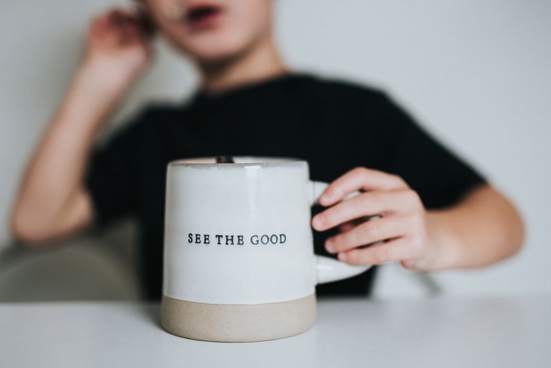 A coffee mug with the words 'See the Good' written on it.