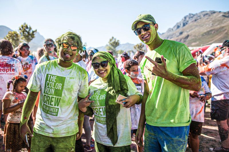 People outside at a color run.