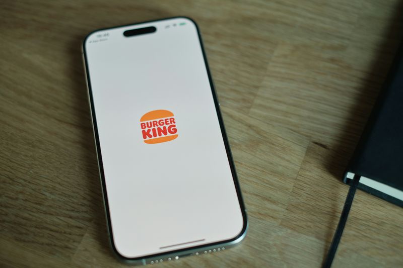 The re-designed Burger King logo on a phone display.