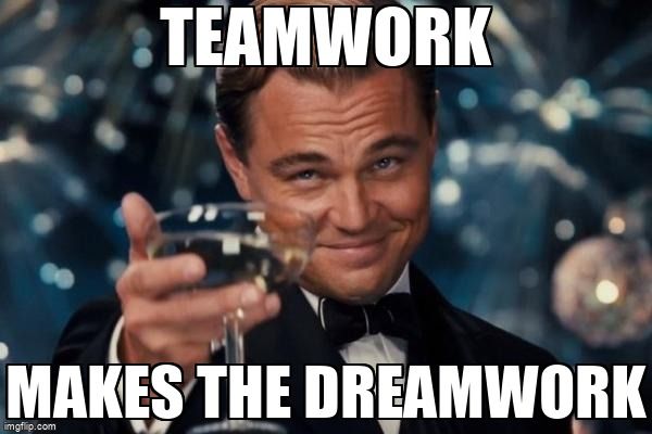 The Great Gatsby holds up a champagne glass. He says,'Teamwork makes the dreamwork.'