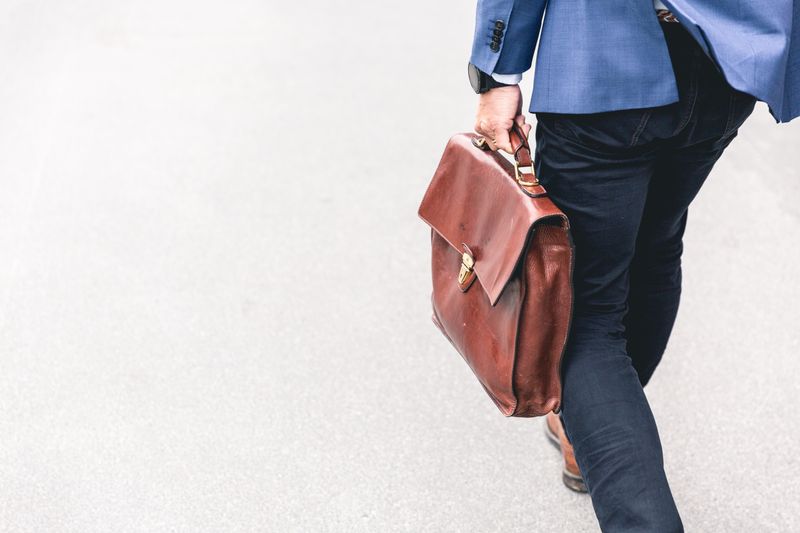 A person walking with a briefcase