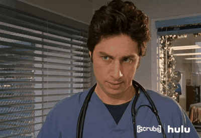 GIF showing actor Zach Braff in medical scrubs with a thoughtful expression