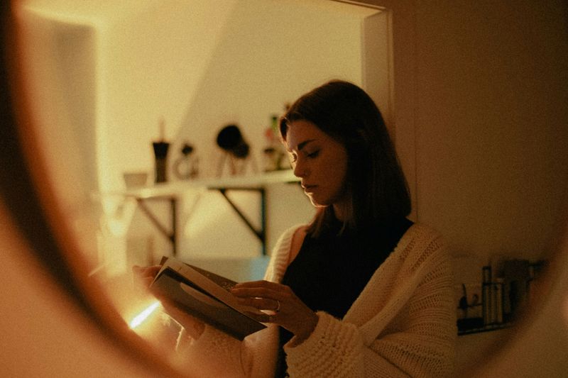 A woman reading her journal and reflecting on her experiences in nature.