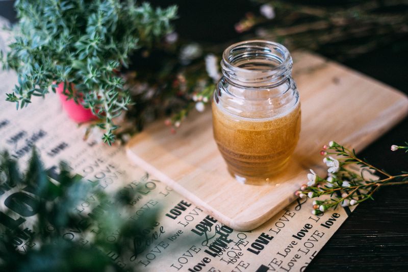 Honey jar on the table. 