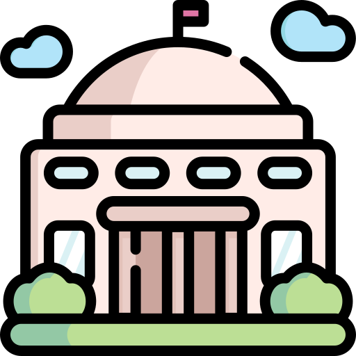 Flat icon of a cream coloured government building on green grass with a tiny red flag on the roof of the building.