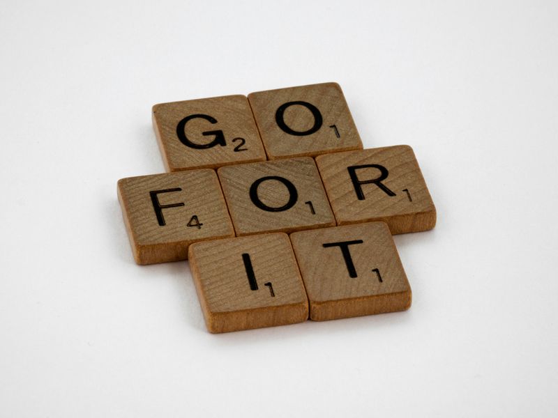 An arrangement of Scrabble tiles that spell out, 'Go for it.'