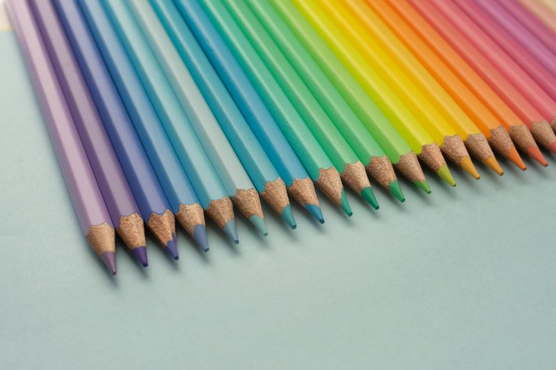 Pencil crayons lined up by color.