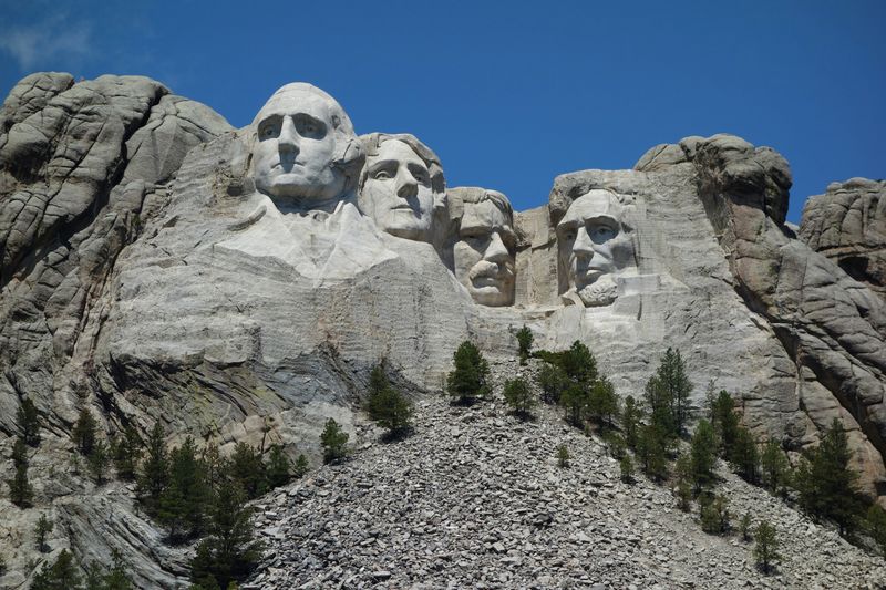 Mount Rushmore, made of igneous rock (the first rock in a rock cycle diagram).