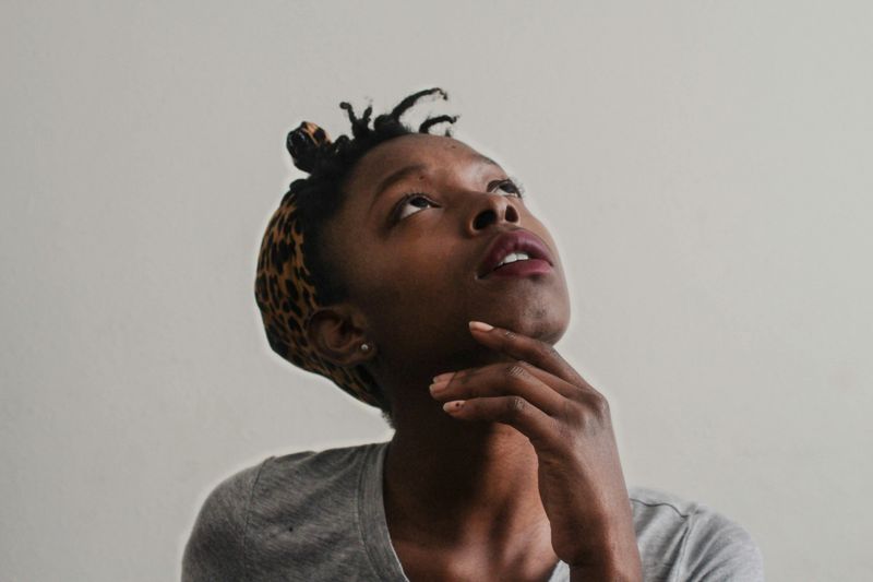 Woman looking up and thinking