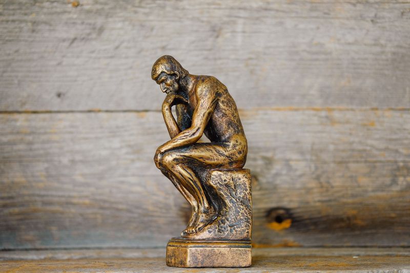 A miniature version of Auguste Rodin's The Thinker.
