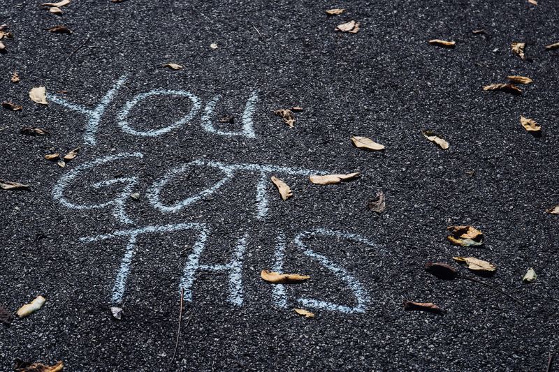 'You got this' written in chalk on the pavement.