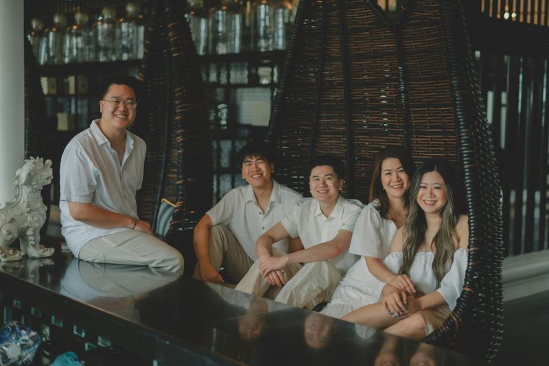 A happy family in a dining room.