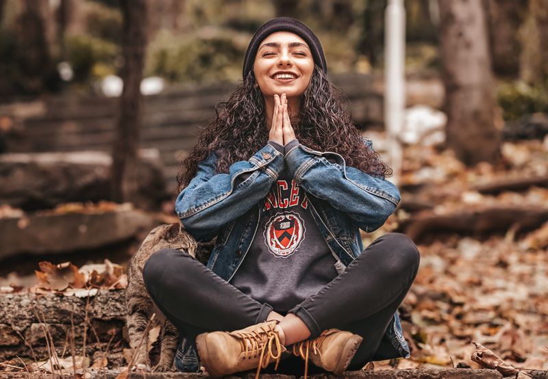 A  woman in a pose of gratitude