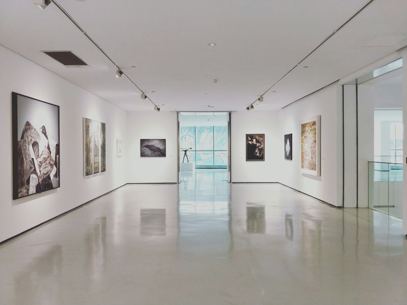 Empty museum gallery with paintings on the wall