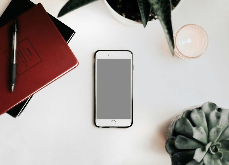 A phone with blank screen on a table.