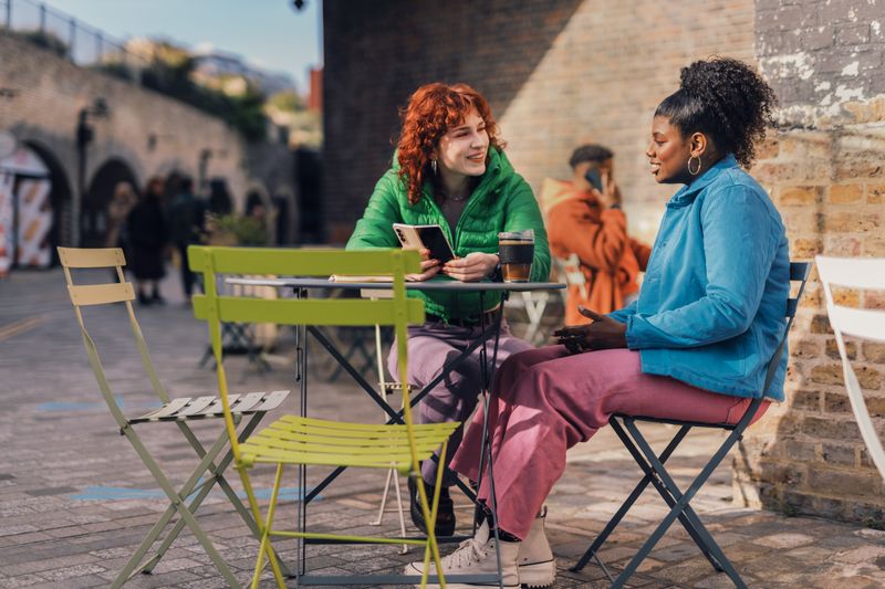 Two friends chatting over a coffee.