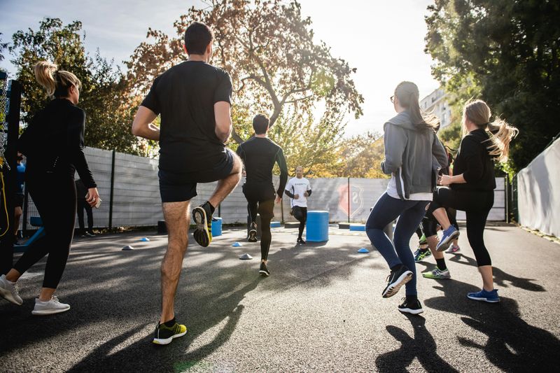 a group of people working out outside