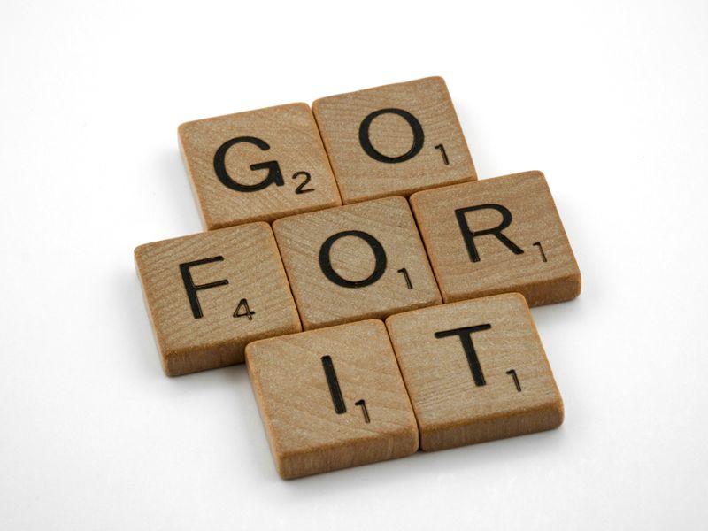 Scrabble pieces spelling our "go for it".