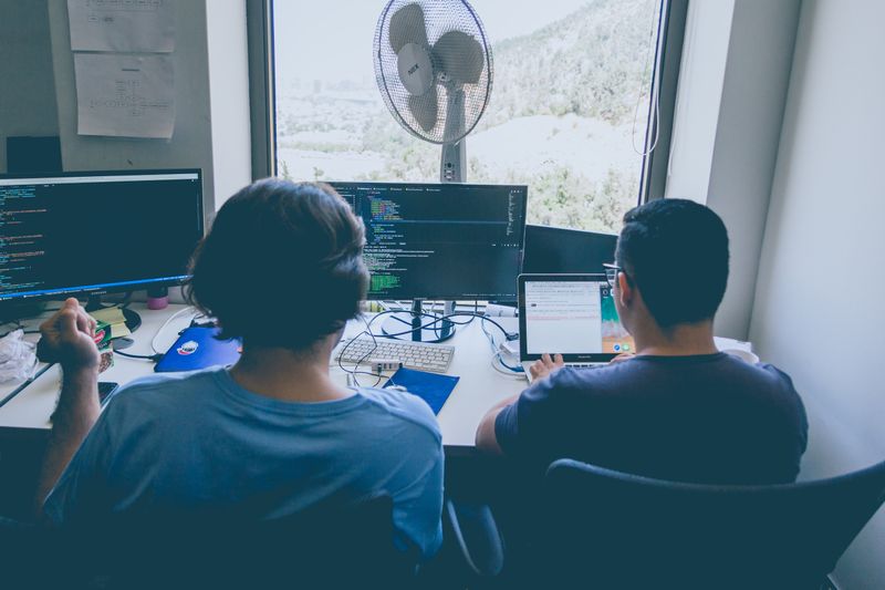 People, working around a computer