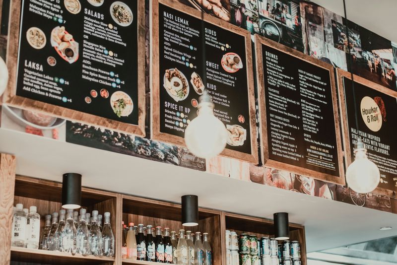 A menu on the wall of a restaurant.