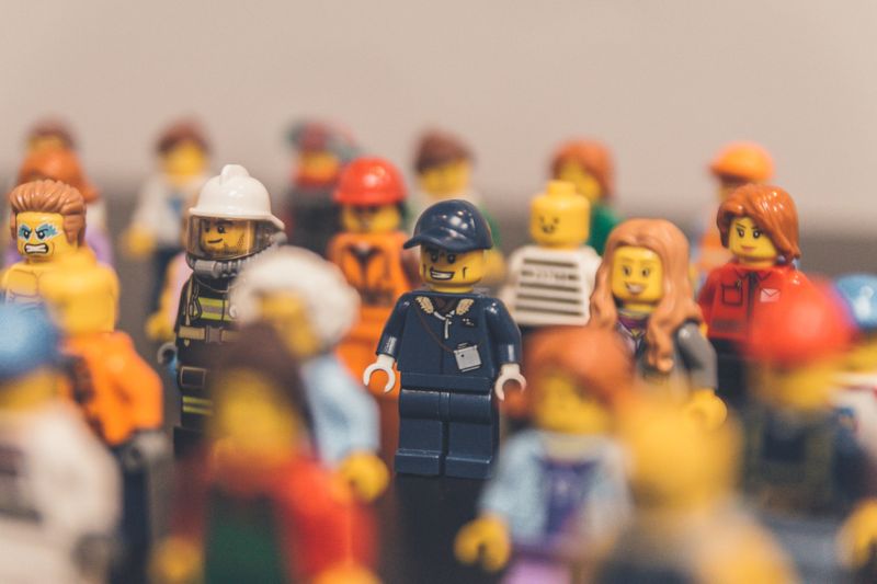 A group of various Lego people stand together.