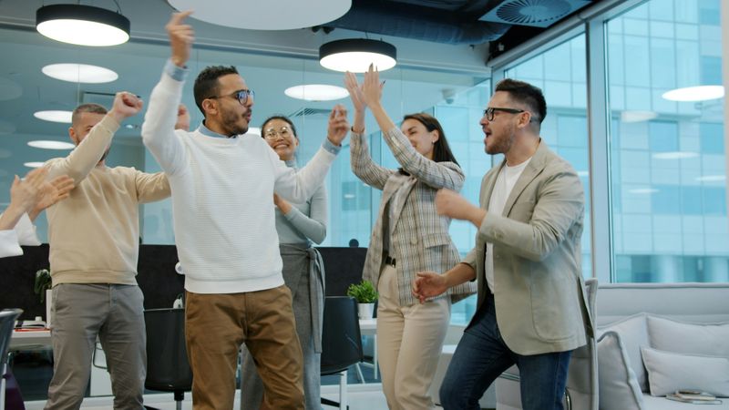 People in office celebrating