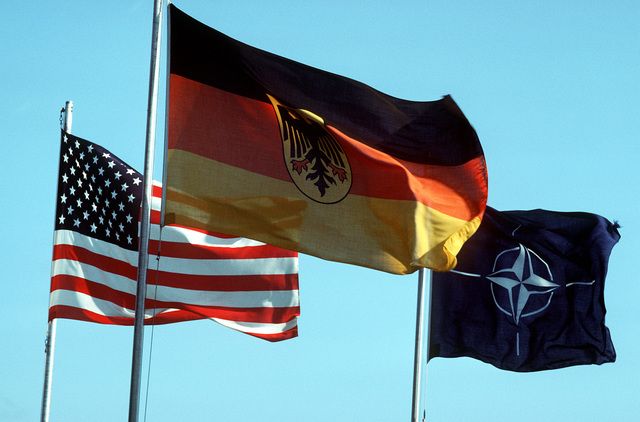 The flags of the US, West Germany, and NATO.
