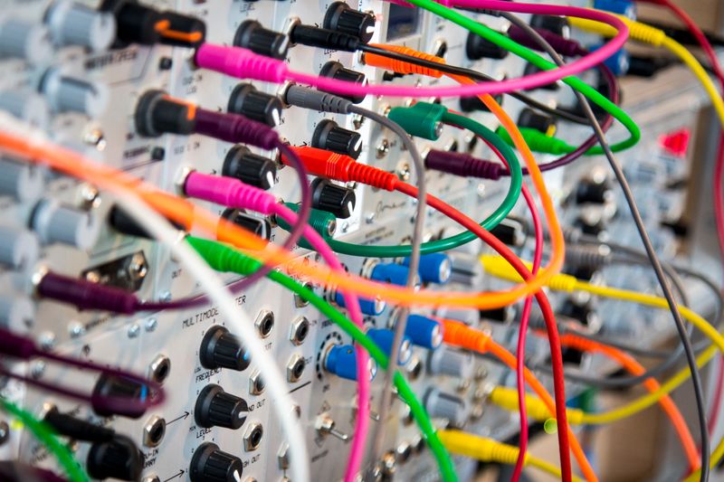 Many complicated connections visualized as a series of audio patch cables