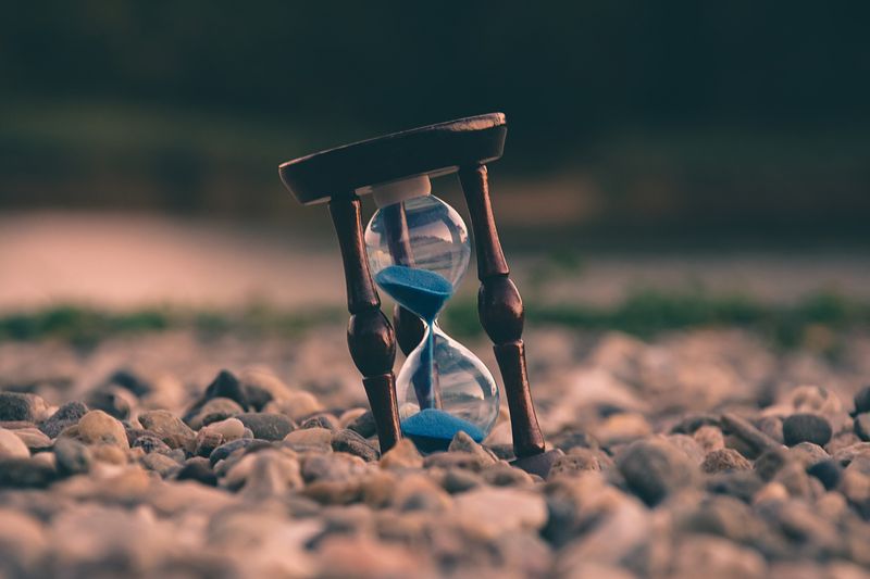  an hourglass in rocky landscape