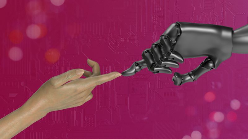 A human index finger gently touches the tip of a metallic, robotic finger of an AI machine.