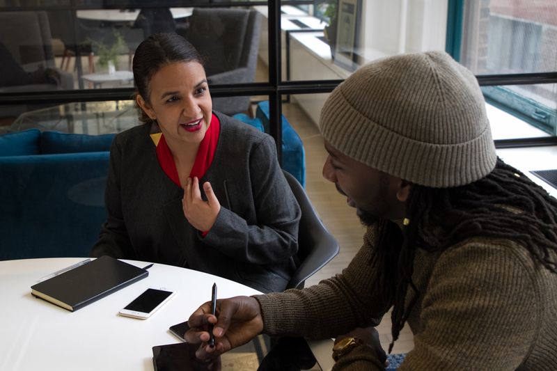 Two businesspeople having a conversation.