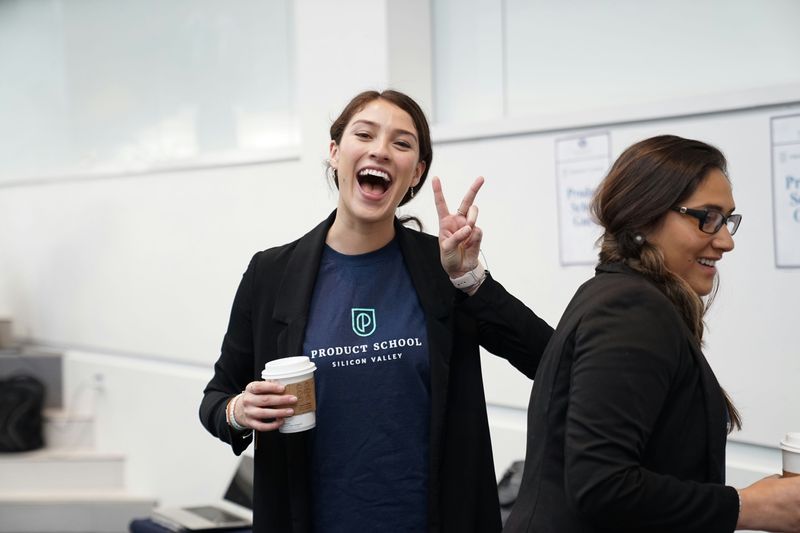 A happy student flashing the peace sign.