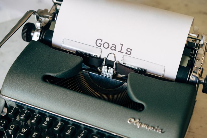 A typewriter with a paper titled, 'Goals.'