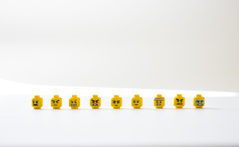 An image of Lego heads depicting different intense emotions.