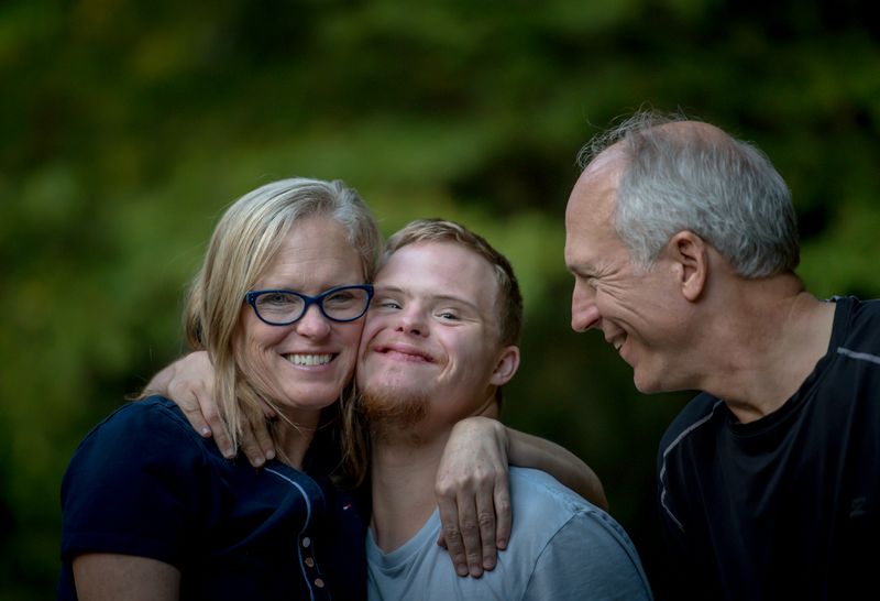 A family shares a joyful hug.