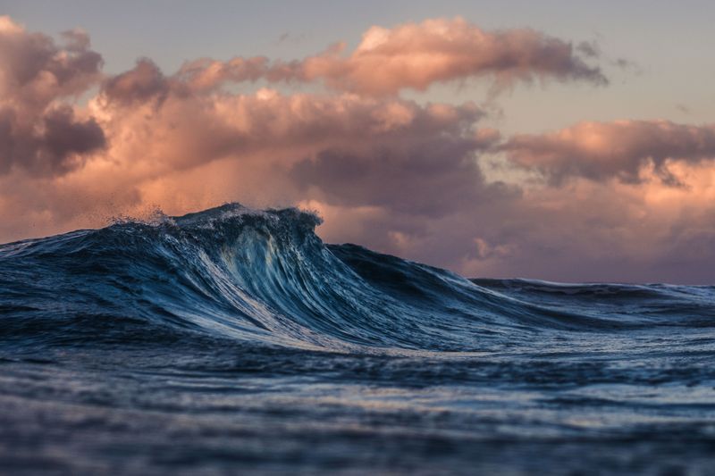 Ocean wave with cloudy skies