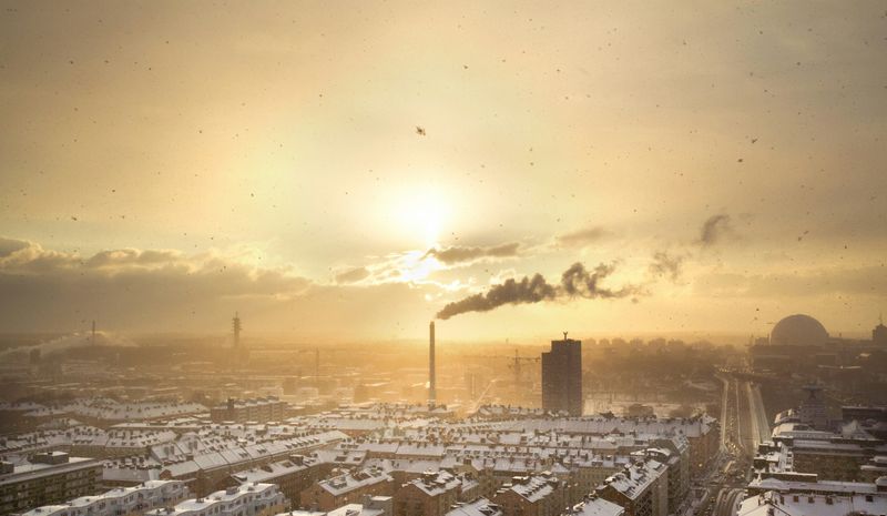 A factory in the distance polluting the environment