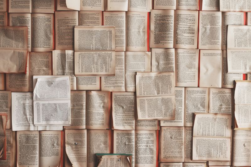 Many books and papers spread out across desks.