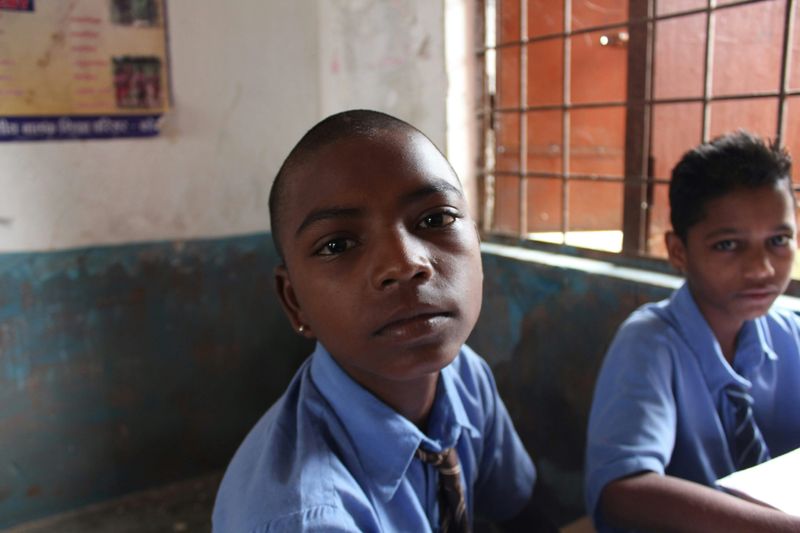Two boys looking unhappy at school.