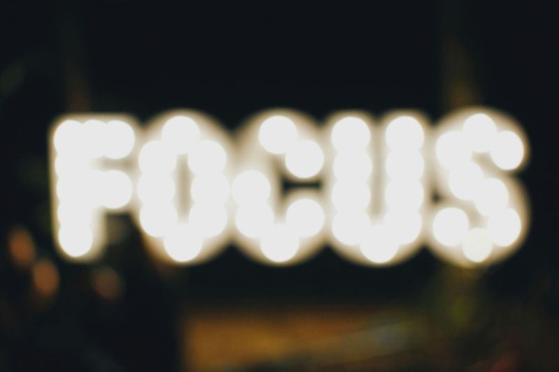 Word 'Focus' blurred in the background