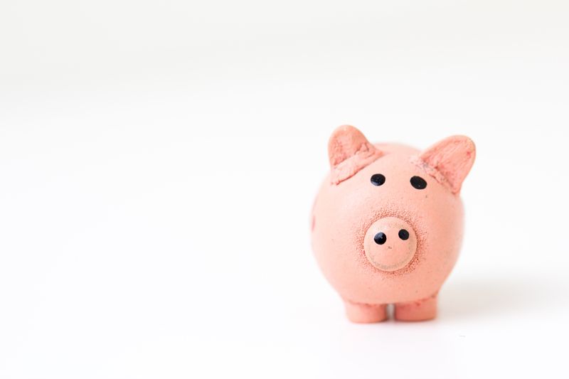 a pink piggy bank with a white background
