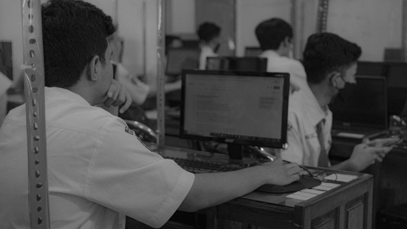 Students working on a digital assignment in a high school class.