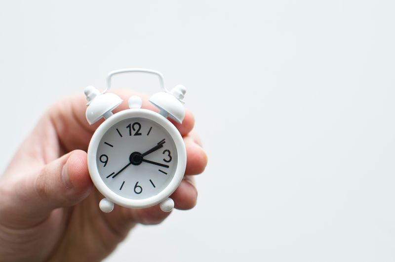 A tiny clock representing a focus on time.