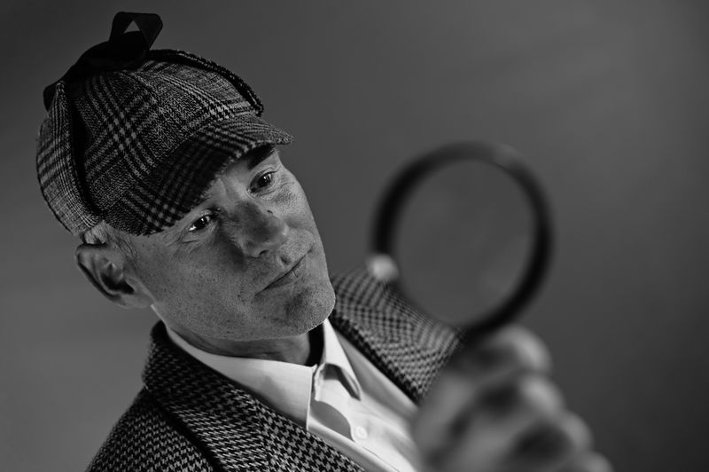 A detective with a magnifying glass.