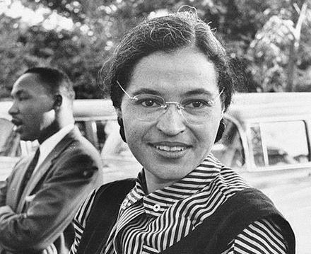 Rosa Parks in 1955, with Martin Luther King Jr. in the background.