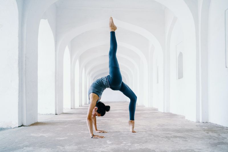 Woman doing a back bend yoga pose
